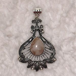 Sunstone on intricate design pendant (Sterling silver overlay)